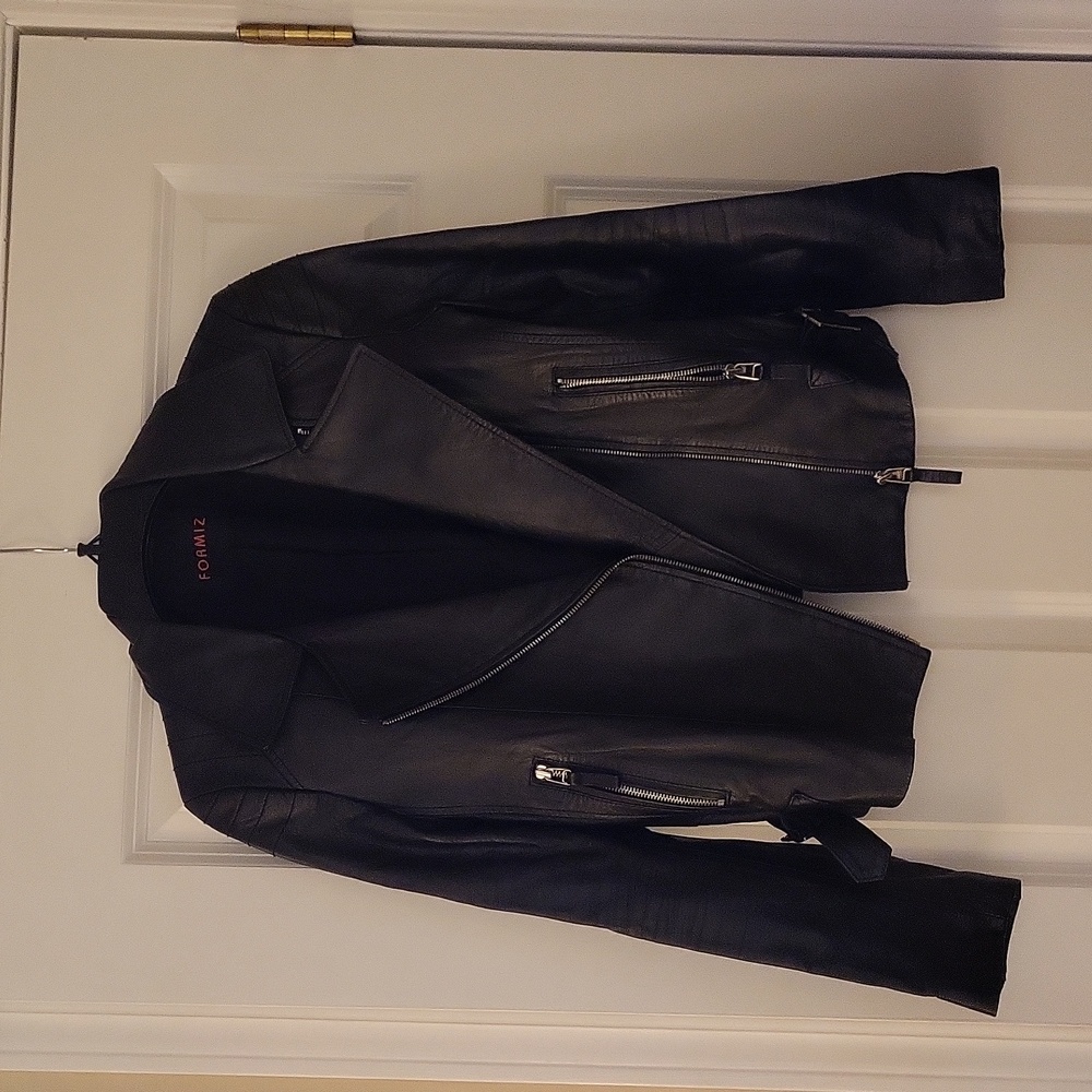 Leather jacket.  No rips or tears. Soft leather